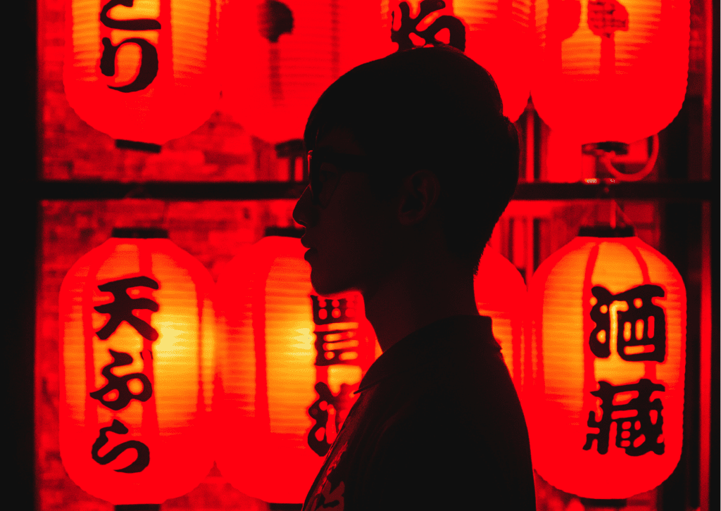 Man over some lanterns with a Chinese inscription