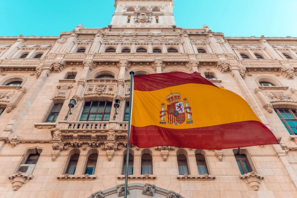 Spanish Flag in front of a building